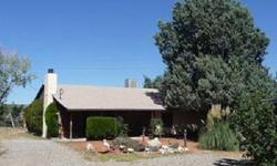 Great location close to town. This property is completely fenced with a horse set-up and a separate guest quarters. The home offers a rustic ranch house type of feel. The property features 3 bedrooms, 2 baths, screened Arizona room, and the back faces