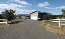 You won't find many deals better than this! 5 acres, 2000 triple wide, modern interior, 2174 sq ft., wood burning fireplace. Heat pump for A/C. 20 gpm well! Shop/garage has tons of storage area. Approx. 2 miles from town. Mt Hood views. RV parking. Super
