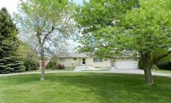 You will love this great home! Sitting on .78 acres this homes park like yard is gorgeous! The entire yard is surrounded by Large Lilac bushes and Large trees. The veiw across the street is just as beautiful. There is a 40X60 shop to hold all your toys.