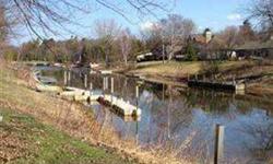 Beautiful canal lot in Inwood Harbor...cleared and ready to build. Easy access to East Bay and Lake Michigan from your dock! Large Mature trees, Paved Road, Natural Gas available..walk to your private shared sandy beach on Lake Michigan for sunsets!! Boat