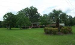 Cute Brick home located in the city of Trenton, Fl. (25 minutes to Gainesville, FL) The home boasts 4 large bedrooms, 2 master suites, 2.5 baths, large bonus room, hardwood floors, fireplace, stainless steel appliance all on 2 landscaped acres. Extensive