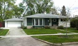 1959 Rambler has been remodeled so kitchen/dining and living area are open. Breakfast bar. Hardwood flooring. 3 season sunroom. 3 bedrooms on main with full bath. 1 bedroom in basement with egress window, 3/4 bath, family room with gas fireplace,