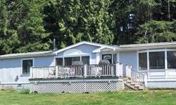 Bright & airy plan 3 bedroom 2 bath manufactured home offering woodsy views on 2.30 acres with 1400 square foot shop. Attractive home boasting a deck, skylights and a bonus room with wood stove/fireplace. Storm windows, Master bath with separate shower