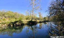 Your Waterfront lot in Prime Location. Beautiful 1.04 acre lot in The Crossing at Spring Creek. Babbling brook at the back, perfect fishing or swimming hole for these hot summer days. Just minutes off HWY 281 for easy access to SA. Neighborhood walking