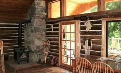 Step back in time. Charming custom crafted 2 bedroom 1.5 bath Log home on 4.9 acres with no ccrs. Right across the street from State land and McArthur Lake Wildlife Area. Thousands of acres of public land to explore. Beautiful granite rock fireplace in