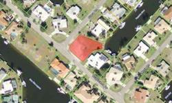 Oversized, corner, waterfront lot in Punta Gorda Isles w/very quick, deep water, sailboat access. The lot is located in the original sailboat section of PGI. Build your dream home here. Lot is surrouned by a mix of older and newer custom-built homes.