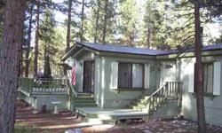 Great location at Eagle Lake. This 3 bed 2 bath sits on 0.55 acres in the pines at Eagle Lake. Large 2 car garage with shop. Big shed with basement (wine cellar). Wood shed holds 10 cords. Big yard is fenced. Inside laundry. Cover deck in back and large