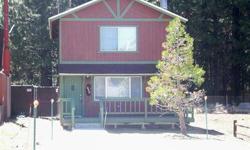 SUPERB LOCATION BETWEEN SNOW SUMMIT AND BEAR MTN SKI AREAS. Ideal for a vacation home or rental. Chalet style cabin offers 2 spacious bedrooms and 2 baths which includes a master suite with privacy deck. Furnishings negotiable, level lot, fenced backyard,
