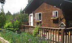 Charm and privacy on nearly 4 beautiful usable acres. The very solid 1200 sq ft home offers cedar ceilings and some walls, giving it a warm cabin feel. Relax and enjoy the views from the wraparound deck. Sauna with wood stove. All less than 15 minutes to