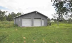 Nice split entry fully finished on 5 acres. Pole building with shop space. Fresh paint and new carpet. Some tile floors. Space to put woodstove or fireplace. Walk-thru laundry to garage. Ready to move in.Listing originally posted at http