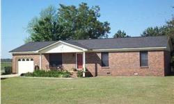 ATMORE, ALABAMA: Classic Country. This charming country-style home features a classic exterior and a luxurious interior design in an economical floor plan. The dining room and the efficient kitchen share a stylish serving bar. Extra room built at the back