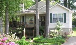 ADORABLE COTTAGE built in 1997 on private 6/10 acre lot at end of street in nice development. Great vacation or year around home nestled in the trees. Close in location. 2 bedrooms and 2 baths with office with closet, open floor plan with fireplace.