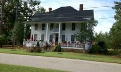 Large Beautiful Updated Home Built in 1900 thats "112 yrs old" in Cairo Georgia on Large Lot just under an acre of land .79 Seperate building (barn) out back for parking and storage also wide variety of fruit trees and grape vines blossoming on grounds