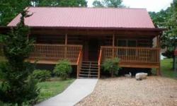 Beautiful Newer Log Cabin! Close to city but in the country! Sit on the rocking chair front porch with coffee in hand! Open floor plan with beautiful exposed beams. Wonderful fireplace. Extraordinary wood flooring. Very nice landscaping.Come and see!