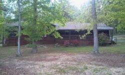 Beautiful Ranch style home with cedar siding, within minutes of Watts Bar Lake! Newly remodeled with real hardwood floors throughout. Home has a half basement and over 2000 square feet on main level. Nice private secluded lot of 4 acres. This home is not