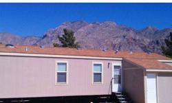 3.55 acres with 2010 2Bed/2Bath manufactured home in Desert Springs, AZ 86432. Previous model. 400 amp power connection, private well, new septic for home. 14 Mobile home sites with complete hook-ups and separate septic. At one time owners were operating