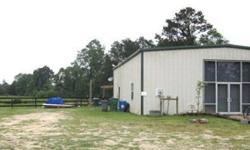 Commercial with large living quartes, six mini storage units w/electricity on 10 acres of fenced pasture with a large pond 14 x 40 screened porch to overlook the pasture and pond. Building has glass storefront and loft storage 2/br 1 full bath and 2000 SF