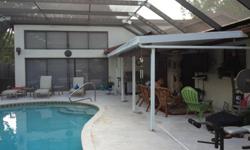 JUST REDUCED $4000! Built in 1978, Concrete block construction, 4/2/2. 2274 sq ft living area. Fireplace, 17,000 gallon heated, screened in pool. New paint in one bedroom, sunken living room, family room, kitchen and dining room. New sink, faucet and