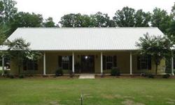Seven Pines-Carroll County- This custom built home has an open floor plan with scored concrete floors,spacious kitchen with lots of cabinets,stainless steel appliances and butcher block counter top, large dining room, nice office, split floor plan with a