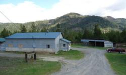 Great investment 2 rentals. Over 400 feet of Hwy 95 frontage plus 4 acres set up for horses with two residences and multiple outbuildings.Commercial potential. Property has electric fence and features garage with haycover and stalls plus an additional