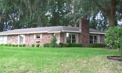 As you approach this beautiful all brick home situated on 1/2 acre MOL and on the 9th hole of the Southern Oaks Country Club, you'll many large live oak trees that canopy the home providing lots of shade for the hot summer months and lots of lovely