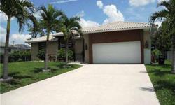 Spacious home on a great street just off West Terry in Bonita Springs. From the royal palms lining the driveway to the glassed lanai in back, this home has been recently carpeted and painted inside and is ready for its new owner. Almost 2000 square feet o