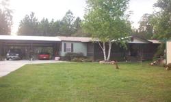 You will be amazed at this property, starting with the concrete driveway - 4 car ports, 3 storage buildings,cleared, 5 acres 330 x 660' parcel. A 10 x50' screened porch with tile floor, living room , formal dinning room, family room, w/ fireplace. A large