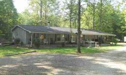 Wooded, private retreat. Enjoy the privacy of beautiful woods, hunting, horses, mushrooms, etc. 2003 home offering 1820 sq ft of living and a covered front porch across entire front of home. Many outbuildings. Only 10 minutes to Cecil Harden Lake and