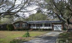 Location, Location, Location is the main attraction to this low maintenance brick home surrounded by beautiful oak trees on a large lot. Just down the street is Wrightsville Beach and any shopping that you desire, plus it's located within a great school