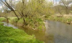 A RIVER RUNS THROUGH IT" - 74 acres with beautiful valley setting and featuring two water sources on the property. The West Fork Kickapoo River runs across the entire width of the east side of the property giving you 2,000 feet of river frontage. Also