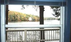Cute,completely updated lakefront cottage. Appliances,furniture,linens,dishes,flatware,24'dock, 17' bowrider boat,canoe. 3 beds, awesome view, sandy beach, lawns, large deck with gorgeous quiet lake views. Beautiful crystal clear ROUND POND!Peggy Hawley