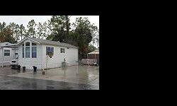 Cute 1/1 Furnished Mobile Home for Sale in Naples Florida! Home sits on a lot that has a 99 year land lease. Mobile Home has an attached screened lanai, Washer & Dryer and Carport. Located in Panthers Walk RV Resort. Resort features WiFi, Pool and