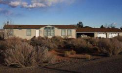 Short Sale Authorized. .Make an offer on this beautiful Lake Powell home located in Big Water, UT, has a wonderful open floor plan, stunning views of the local scenery, private deck with hot tub, and so much more. Located in the high hills of East Big