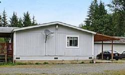 Private manufactured home nestled on 4.73 acres. Spacious double-wide with a detached garage for 2 cars and shop. Surrounded by trees. Level, dry, and all usable (per seller).Ben Kinney is showing 1611 177th Avenue NE in Snohomish, WA which has 3 bedrooms
