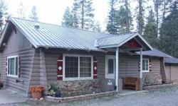Are you handy? If so this is the cabin for you. Take your time and restore this D Log Cabin to its full potential. Almost 1/3 acre with easy access on paved and maintained county road. Plenty of tall pines, circular drive leading to a great 2 car garage