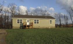 Bank Foreclosure. 2-year-old Modular Home. 3 bedrooms, 2 baths, 6 plus acres, full basement, front, rear and side porch, kitchen island with breakfast nook, 5/12 pitch roof, all interior drywall package, thermopane windows, 200 amp service, 12? overhangs,
