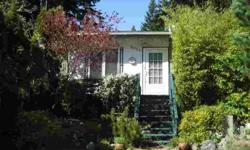 Quintessential Whidbey, set on a gorgeous sunny, near half acre! Quirks & charm, plus a terrific combination of rooms and outbuildings for artist areas or workshops. The heart of the home, the kitchen, is central to the dining and living rooms. This fully