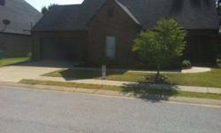 MOSTLY BRICK OUTSIDE WITH SOME SIDING, FENCED IN BACK YARD, TWO CAR GARAGE 3 BEDROOM TWO BATH WITH FIREPLACE, CEILING FANS BLINDS ON ALL WINDOWS. HARDWOOD FLOORS IN DEN AND FOYER AND HALLWAY. CERAMIC TILE IN BATHROOMS. LINOLEUM IN KITCHEN.