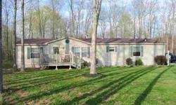 2002 Commodore model with 3 bedrooms, 2 baths and 30x50 4 car garage/shop. Great for many uses including business. All on 5 wooded acres great for hunting. Lots of room for big boy toys! The home features a wood fireplace with gas log, open floor plan