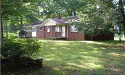 All brick home with 3 BRs, hardwood floors, partial basement. House will be sold with approximately 1 acre, to be determined and surveyed from the 40+ acre total tract. Seller will lease the acreage to the home buyer if interested. Great for horses, with