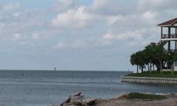Two Waterfront Lots being sold together. Lots face South and property should provide a fantastic view of the bay from your future balcony. Fish from your future dock or take your boat out into the Bay. Property is conveniently located on the corner