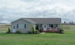 Better than New! This 3 bedroom, 2 bathroom Rancher is perfectly staged for the most discriminating buyer. Located on 5 acres with sweeping views of the west plains and Mount Spokane this charming home features new flooring throughout, updated kitchen