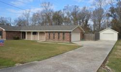 Four bedroom Two bath home large kitchen with plenty of cabinets and counter space living room has beamed cielings fire place, formal dining room, and den. Large fenced in yard double garage and seperate work shop. Make your appoint ment to see this home
