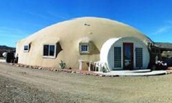 WANT UNUSUAL? HERE IT IS. AN ENERGY EFFICIENT 60' MONOLITHIC DOME. GREAT ROOM, LARGE KITCHEN & DINING, LARGE UPPER BONUS/STORAGE ROOM. COVERED PATIO & VIEWS, 2400+/- SF, 2 CAR GARAGE, 3 BEDROOM, 2.5 BATHS! CORNER LOT WITH LOTS OF FOLAGE AND SEASONAL