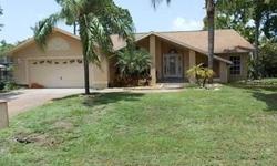 Great Opportunity! Large Unique 3 Bedroom 2 Bathroom Home in Bonita Springs. 2 Car Attached Garage. Brick Paver Driveway. Nice Entry Foyer. Features include Vaulted Ceilings, Arched Windows, Diagonal Tile Throughout Except for Bedrooms, Decorative Tile,
