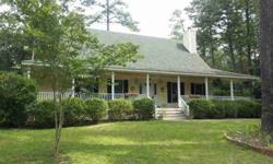 This is a lovely home located on a wooded lot in Camden County. Exterior is very appealing with large front porch along the entire front of house with a swing. Interior is very attactive with a down home feeling. Come look at this Wonderful Country home