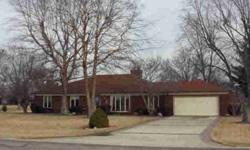 LOCATED ON THE 12TH TEE OF MATTOON GOLF & COUNTRY CLUB . . . This comfortable, three bedroom, two bath, brick ranch features formal living room with "see through" gas fireplace to generously-sized family room with built-in cherry shelving and cabinetry,