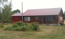 Cedar Log Home for Sale This gorgeous home was built in 2002 on 7.37 acres and features an open floor plan and plenty of storage. The home includes three bedrooms and two full baths along with a basement. The entry way is bright and cheery leading to the