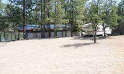 PINE HOLLOW LAKE FRONT. Older single wide w/metal cover, deck, fire pit, dock.Listing originally posted at http
