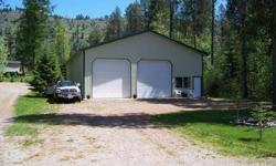 All Parked Out! ready to play, sunvale acres river lot! .5 acre lot w/76 ft Shop 40 x 60 with bath and sleeping area, lots of storage,pud water & power installed , full RV hook ups , dock system, great views,front on county rd,recreational area, boat
